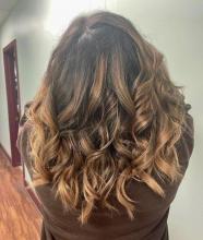 warm brown balayage ombre highlights caramel blonde brunette brown curled hair blowout brantford hair school salon hairstylist hairdresser hair colour near me