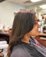medium long hair cut blunt one length with face framing layers and curtain bangs trendy tiktok long layered haircut hair cut affordable hair services near me appointments available and walk ins at the best hair school in brantford for hairstyling barbering aesthetics college diploma hairstylist hairdresser hair salon