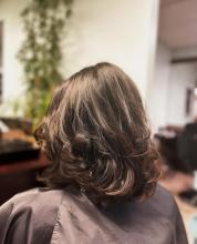 womens short hair medium length hair cut haircut idea 2023 trendy cut thick full voluminous curly hair with layers and movement 90s hair volume gorgeous hairstyle affordable hair services cuts and blowout near me in brantford ontario from top rated hair school hairstylist hairdresser hair school in brantford offering hair styling college diploma program