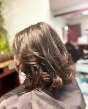 womens short hair medium length hair cut haircut idea 2023 trendy cut thick full voluminous curly hair with layers and movement 90s hair volume gorgeous hairstyle affordable hair services cuts and blowout near me in brantford ontario from top rated hair school hairstylist hairdresser hair school in brantford offering hair styling college diploma program