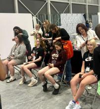 granderie epic jobs fair gedsb trade school show for brantford students shallow creek academy of hair design demonstration braiding students hair long line of students braids volunteers 